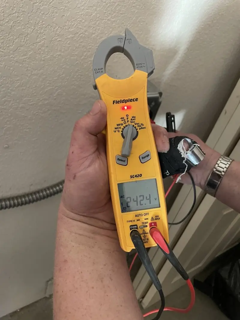 Voltage testing with clamp meter during Ceiling Fan Installation in Brookfield
